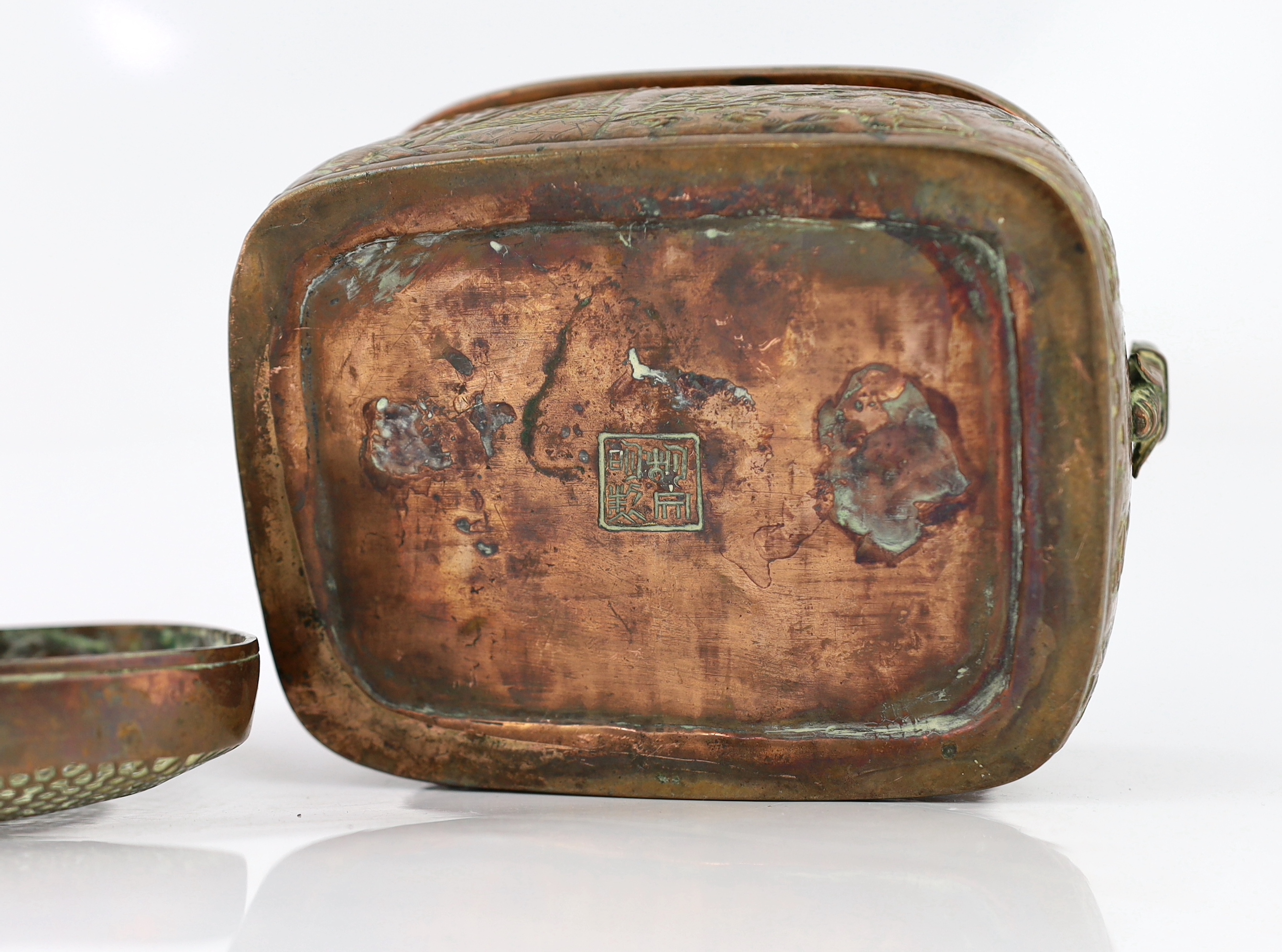 A Chinese embossed copper hand warmer, 17th/18th century